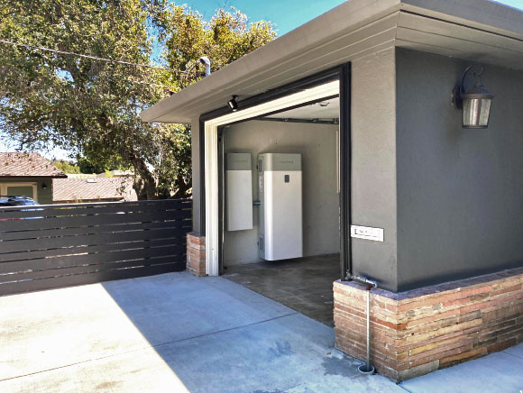 SunVault home battery installation beside a garage